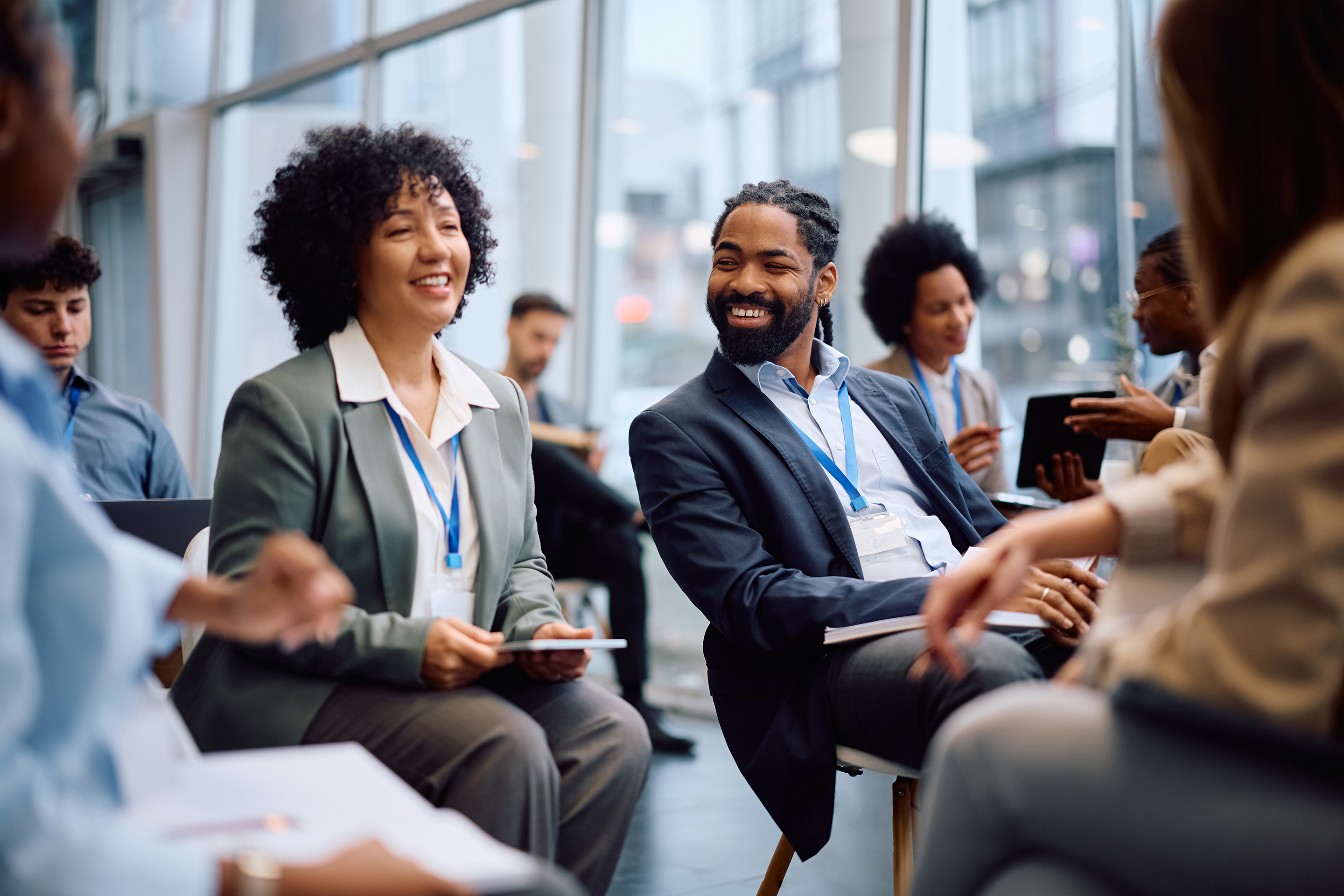 Smiling attendees at a corporate conference